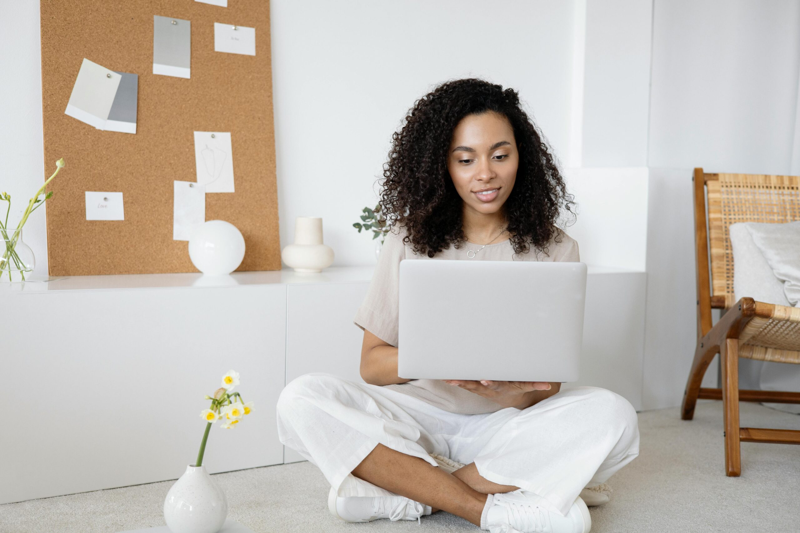 A woman working on her laptop.